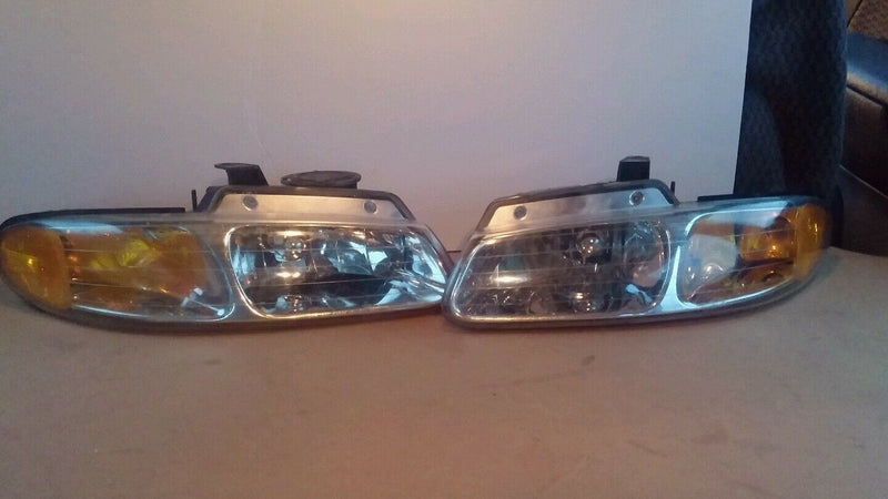 Clean PREMIUM Dodge Caravan 1996 through 2000 headlight assembly left and right.