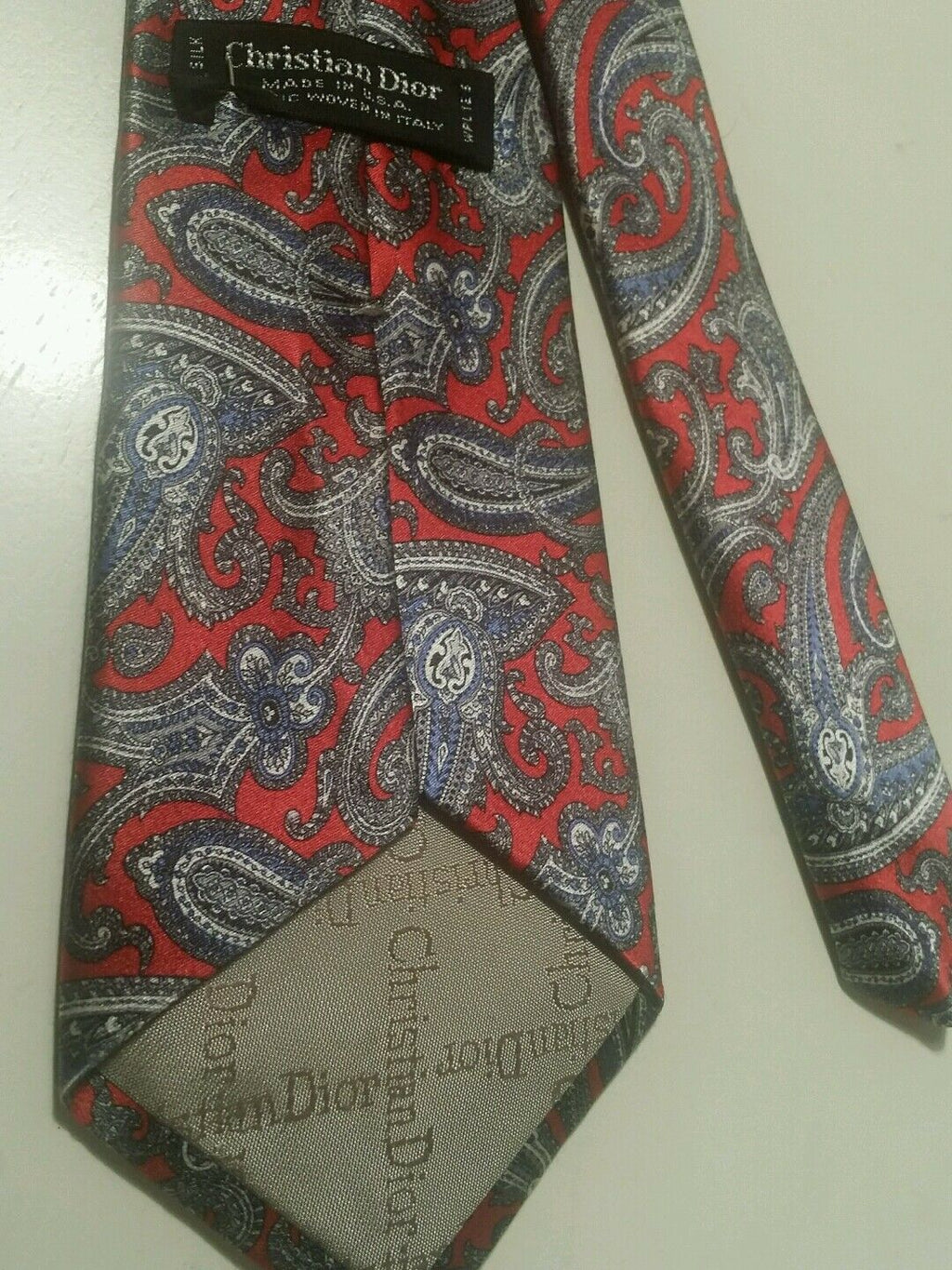 CHRISTIAN DIOR RED AND GRAY PAISLEY PRINT NECKTIE.