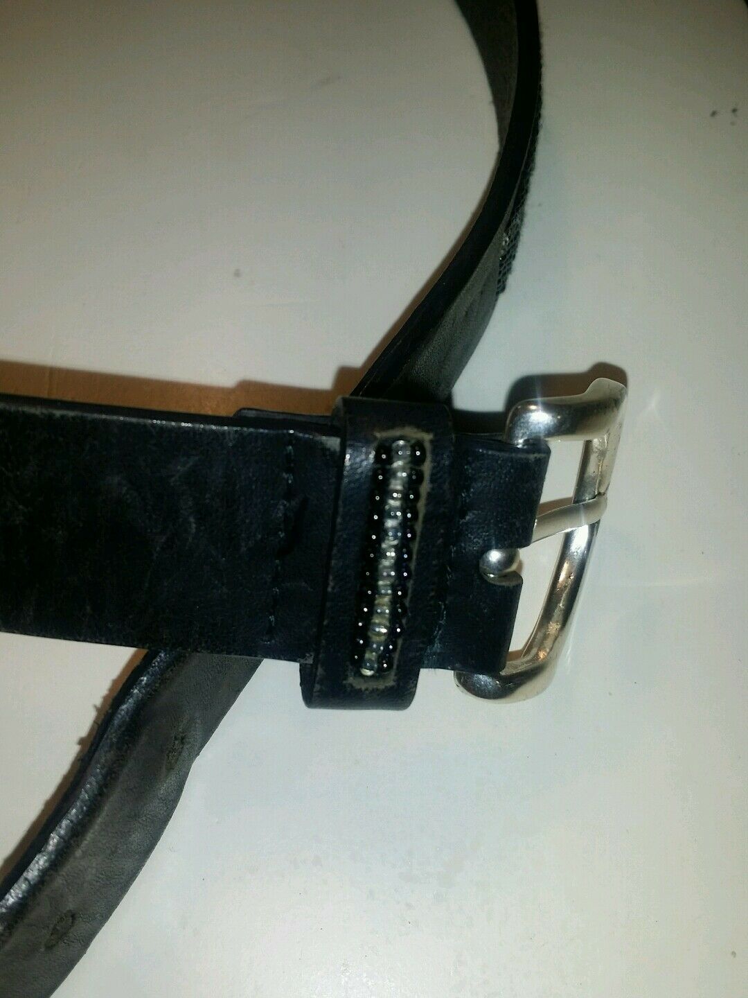 The limited black leather sequin solid brass buckle.