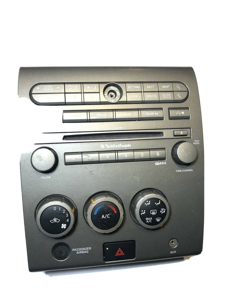 2004-2005 Nissan Armada climate 6-disc stereo control faceplate wood grain bezel