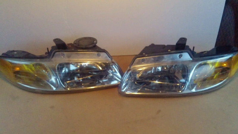 Clean PREMIUM Dodge Caravan 1996 through 2000 headlight assembly left and right.