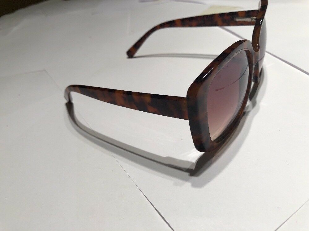 a Brown Tortoise Shell Plastic Holiday Over Sized Square Sunglasses In Case