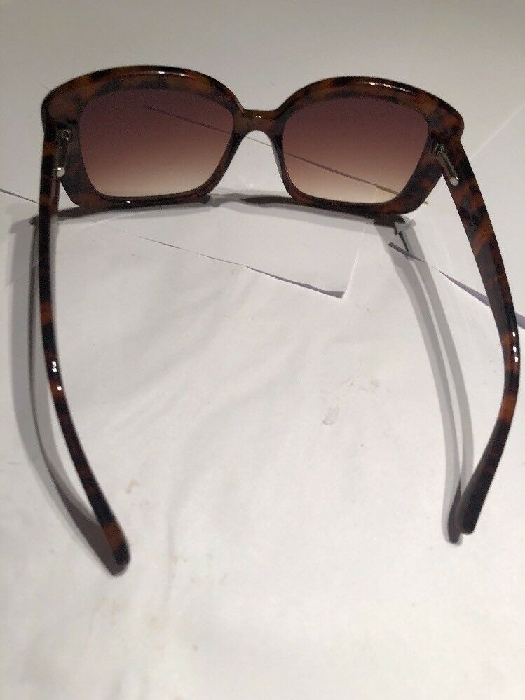 a Brown Tortoise Shell Plastic Holiday Over Sized Square Sunglasses In Case
