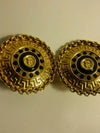 rare exotic gold plated Egyptian print clip on earrings.