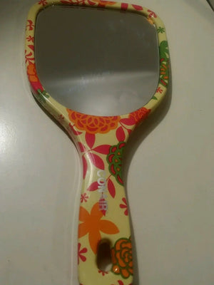 small bright floral design conair mirror