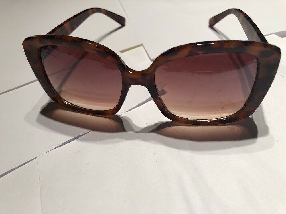a Brown Tortoise Shell Plastic Holiday Over Sized Square Sunglasses In Case