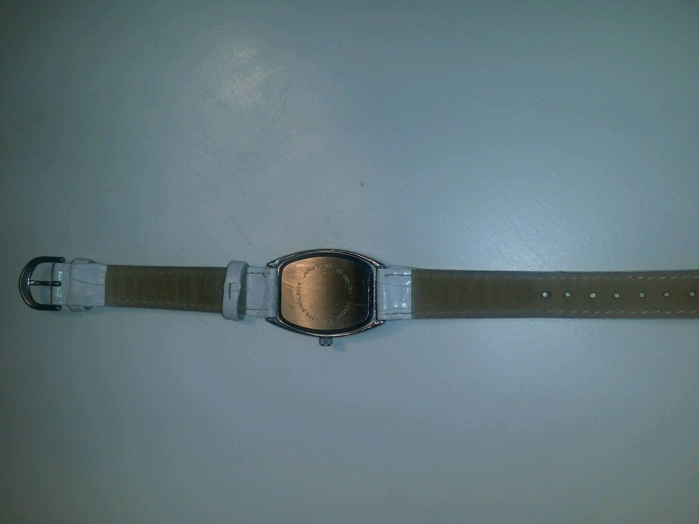 white quartz watch multi colored numerical batteries n/a