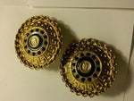 rare exotic gold plated Egyptian print clip on earrings.