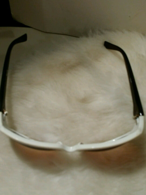 white oversized vanity sunglass frames wih brown arms