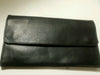 Brand star black leather snap wallet with snap closure.