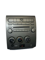 2004-2005 Nissan Armada climate 6-disc stereo control faceplate wood grain bezel