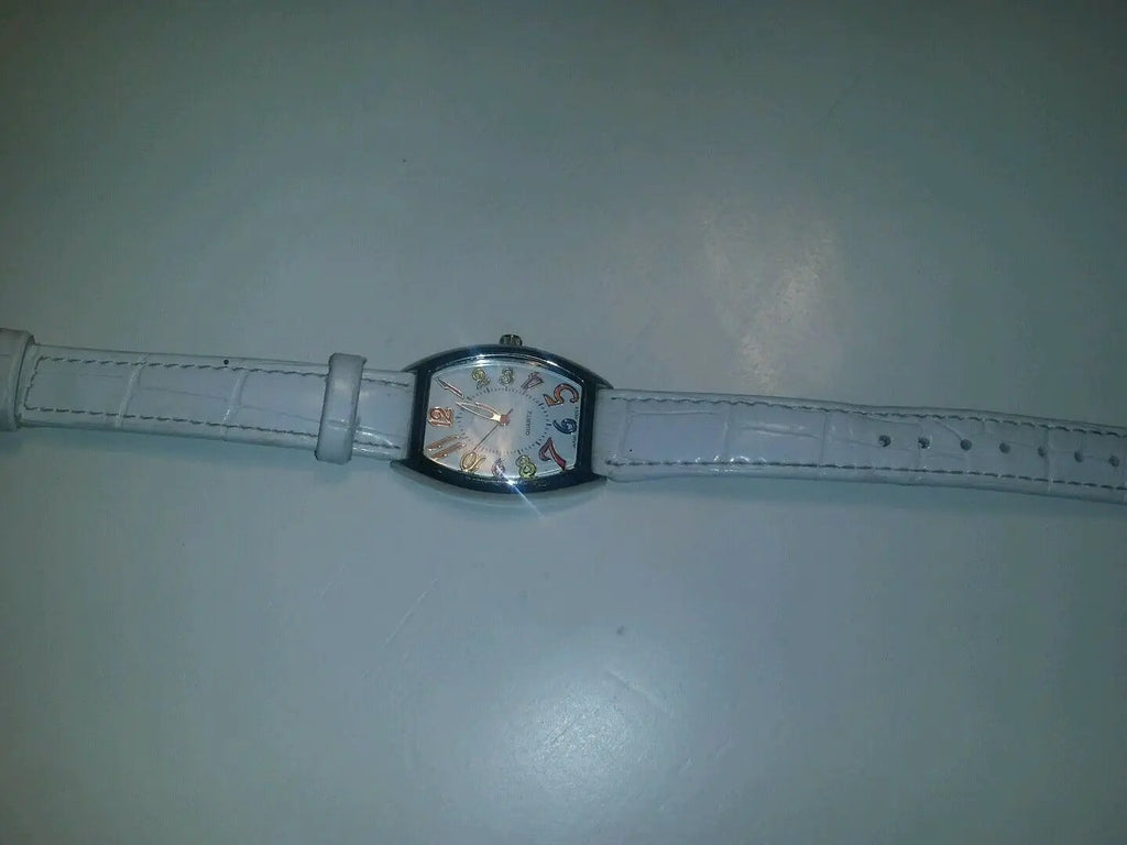 white quartz watch multi colored numerical batteries n/a by DALEY1DEALS,LLC.