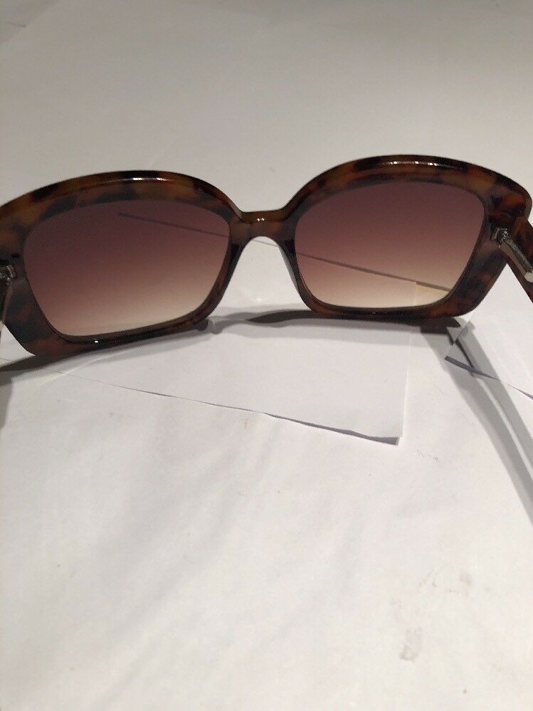 a Brown Tortoise Shell Plastic Holiday Over Sized Square Sunglasses In Case