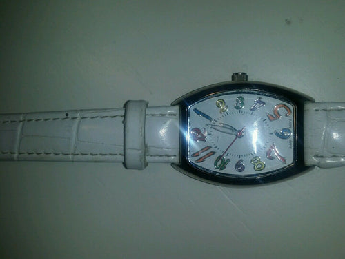 white quartz watch multi colored numerical batteries n/a