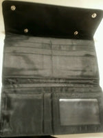 Brand star black leather snap wallet with snap closure.