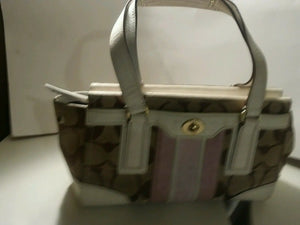 Coach signature satchel white leather trim and also mauve.