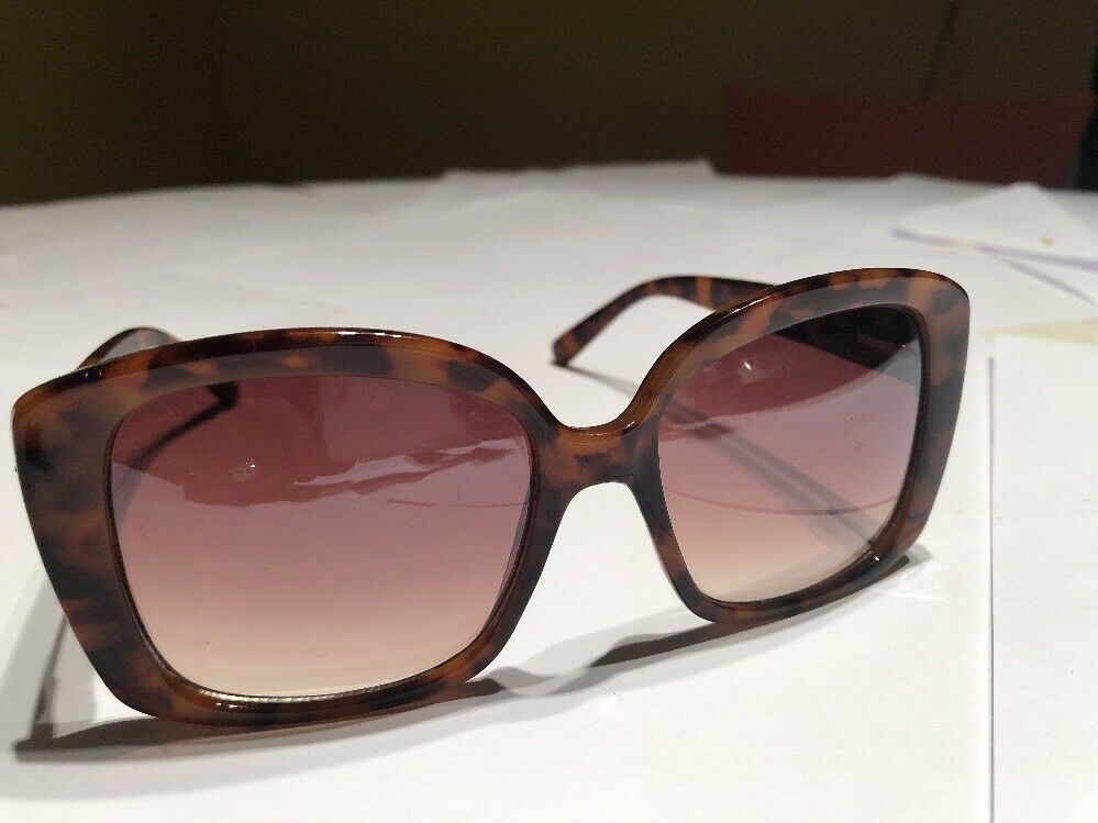a Brown Tortoise Shell Plastic Holiday Over Sized Square Sunglasses In Case