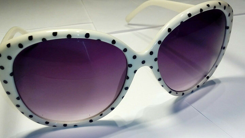 oversized  white  and black  polka-dot  sunglasses.