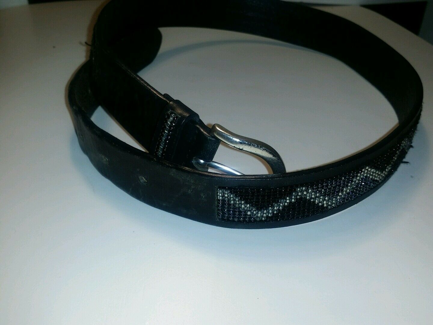 The limited black leather sequin solid brass buckle.
