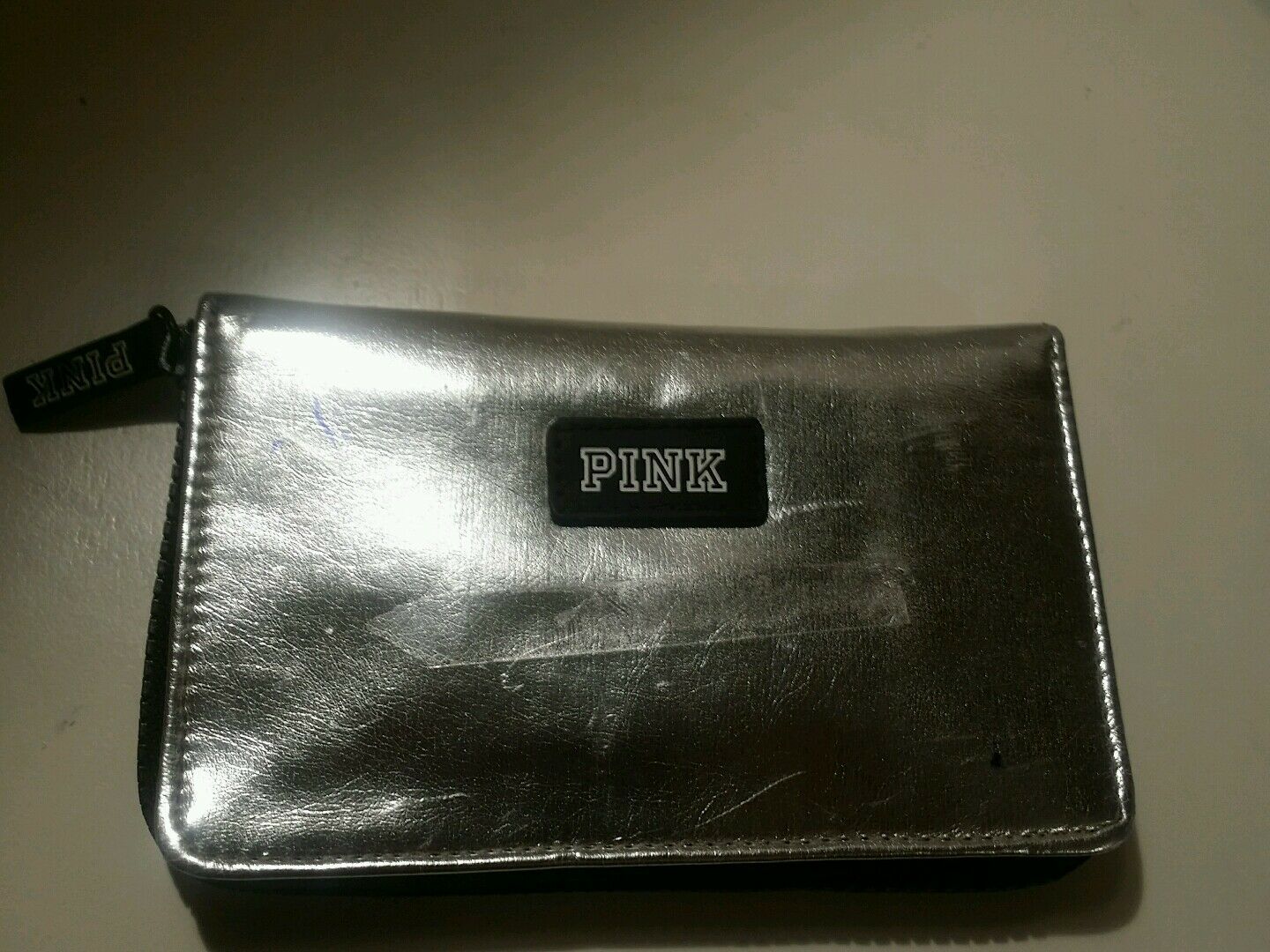 silver metallic zip around love pink clutch