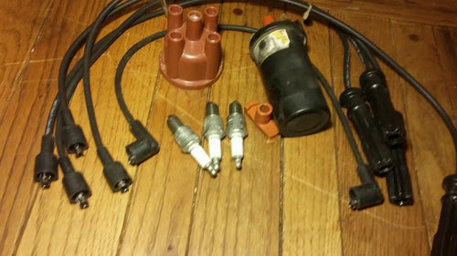 1993 VOLVO 240 COMPLETE 4 SPARK PLUGS PLUS 5 WIRES, ROTOR & CAP DISTRIBUTOR SET by DALEY1DEALS,LLC.