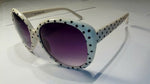 oversized  white  and black  polka-dot  sunglasses.