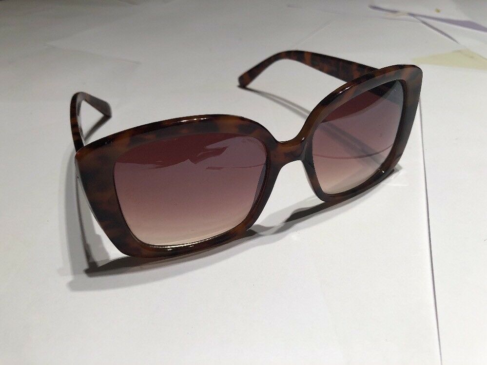 a Brown Tortoise Shell Plastic Holiday Over Sized Square Sunglasses In Case