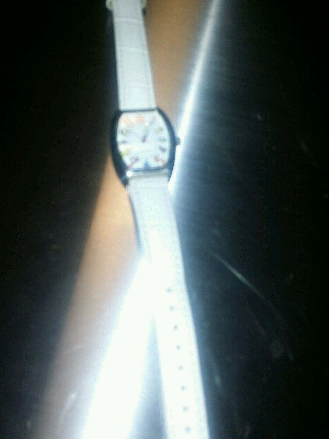 white quartz watch multi colored numerical batteries n/a