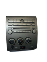 2004-2005 Nissan Armada climate 6-disc stereo control faceplate wood grain bezel