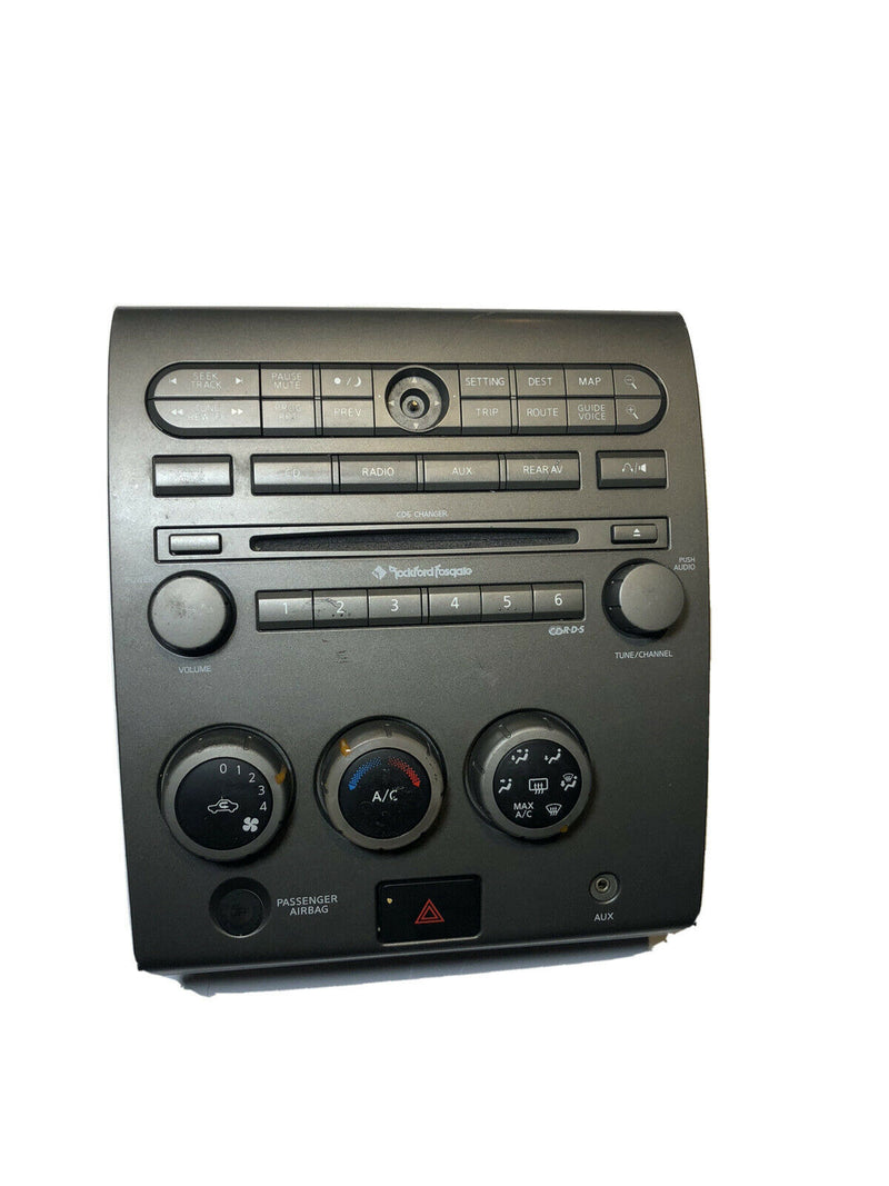 2004-2005 Nissan Armada climate 6-disc stereo control faceplate wood grain bezel