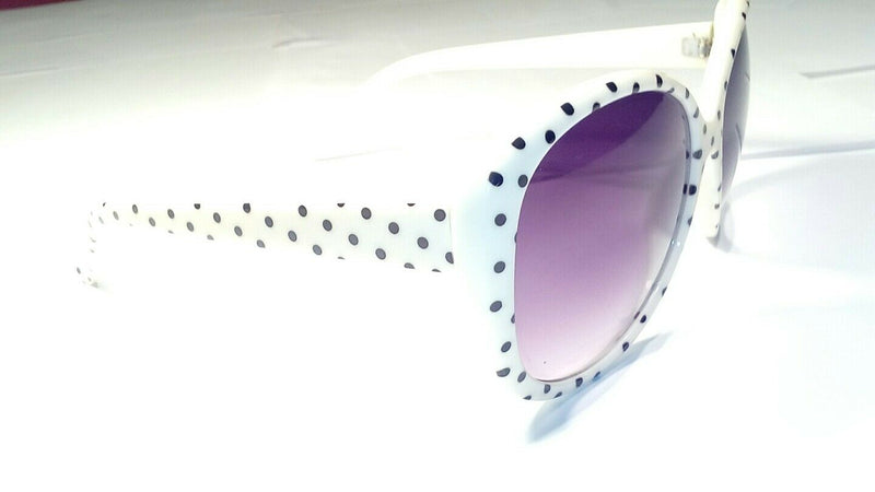 oversized  white  and black  polka-dot  sunglasses.